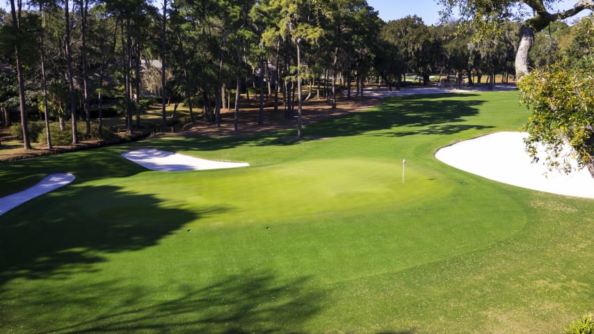 Trees line both sides of the fairway, necessitating a straight shot from the tee. A large bunker guards the front of the green, with three more positioned to the right. A medium to short iron should get the job done, but the small green can be hard to hold.