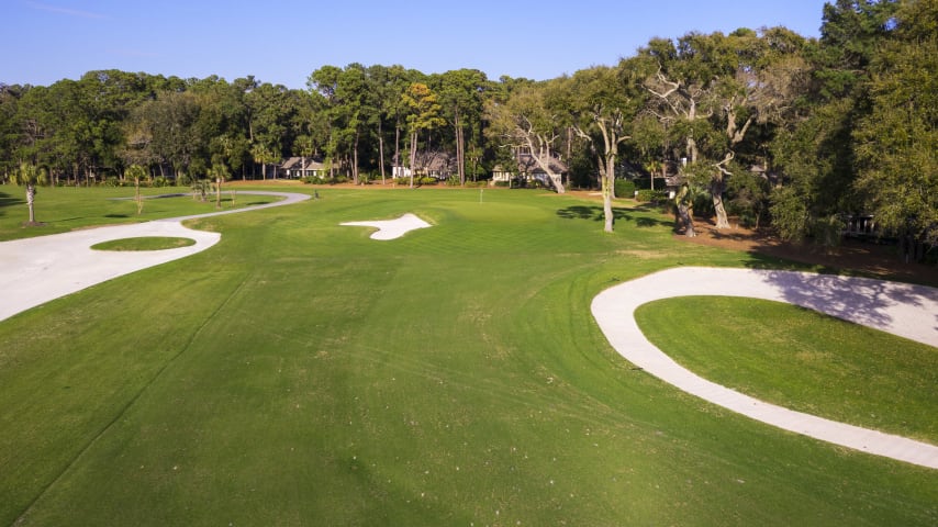 Aim just to the right of the left fairway bunker, and then calculate your odds of making the green in two. The obstacles: A massive strategic bunker to the right, water and a greenside bunker left. A deep but narrow green falls off to the right and rear.