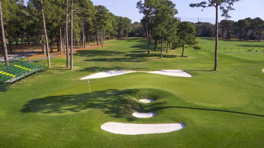Placement is more important than power on this short but deceptive par 4. Drive to the middle of the fairway and avoid battling trees on your approach. The heart-shaped green is protected both in front and behind by sand.