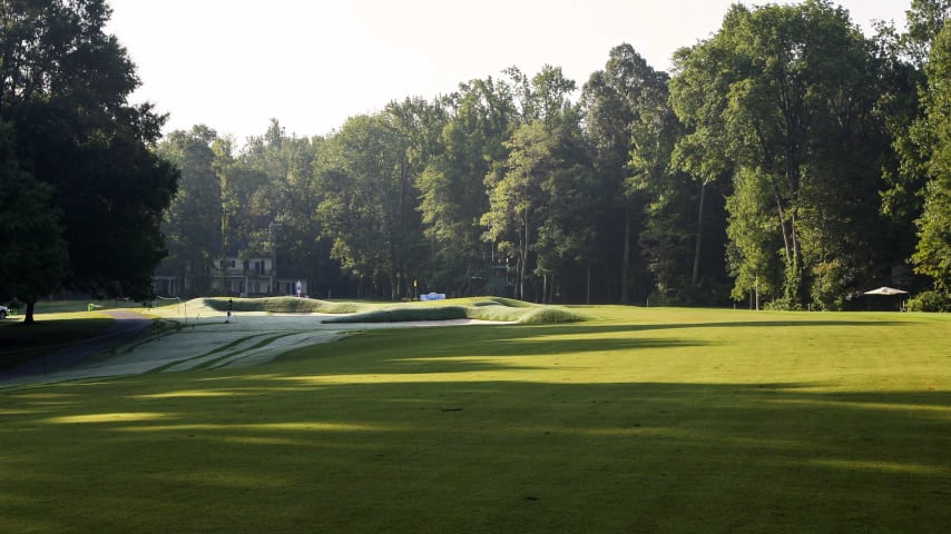 An uphill par 4 that requires a strong drawing tee shot. The ideal approach is right of center to avoid the deep carry bunker short left of this undulating green.