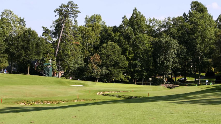 Three prominent bunkers on the right suggest a left to right tee shot. The player who skirts these bunkers will be rewarded with a shorter approach and better angle in the left to right sloping green.