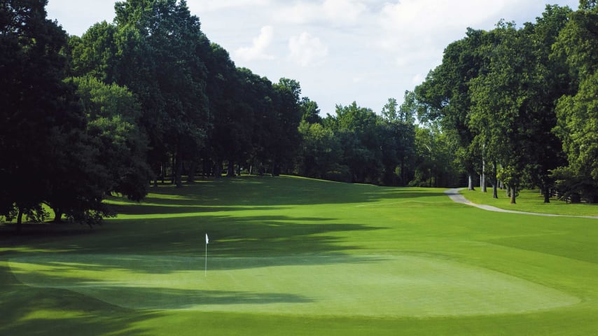 Additional length will require a semi blind tee shot to a left to right sloping fairway. The ideal drive is hard up the left side near the bunker. This low profile green is accessible with an aerial or low running ground stroke.