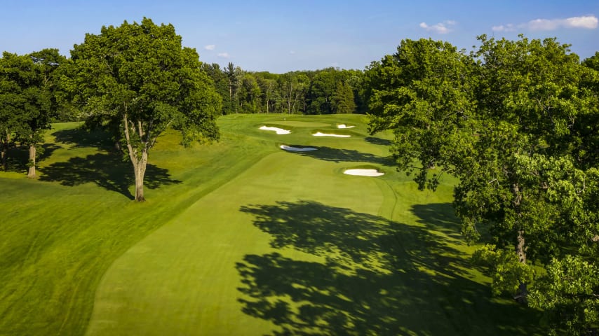 A short uphill par 4 with trees on both sides requires an accurate tee shot. A small right fairway bunker demands a carry of at least 285 yards. The short approach shot is hit to a green that slopes from back left to front right with three greenside bunkers guarding the front. (Source: PGA of America)