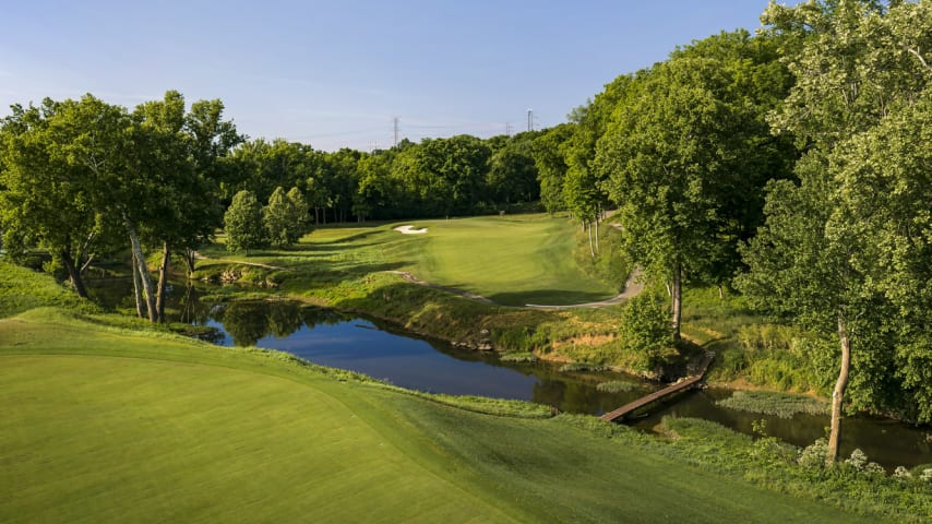 Long Shot: The name “Long Shot” refers not to distance but one’s chance of making a par on this difficult hole. It demands an accurate tee shot, and for some players will be something less than a driver as the aim is to get as close to Floyd’s Fork as one dares. Even after a good drive, players will still be looking at over 200 yards to a challenging green complex: A deep bunker guards the left side, a closely mown collection area lurks on the right. (Source: PGA of America)