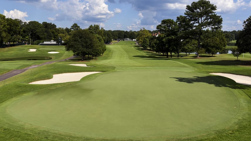 The drive on the first hole of the back nine requires the player to be on the left side of the fairway to have the best shot at the green. Two bunkers right of the green and one bunker left are ready to capture an errant shot. The deep bunker on the right makes a back right hole location the toughest.