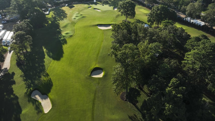 Three tall pines on the right side of the fairway force players to hit a fade to the best position in the fairway. With a good drive, players can reach this short par 5 in two. A well-bunkered green poses problems if missed long or short. One of the easiest holes at East Lake, a par here will drop a shot to the field.