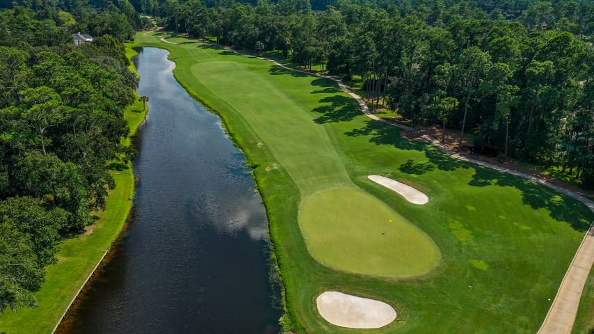 The 10th is guarded on the right by water for the entirety of the hole, creating a desire to play up the left side, which brings some difficult rough into play. The green is protected by bunkers short left and back right.