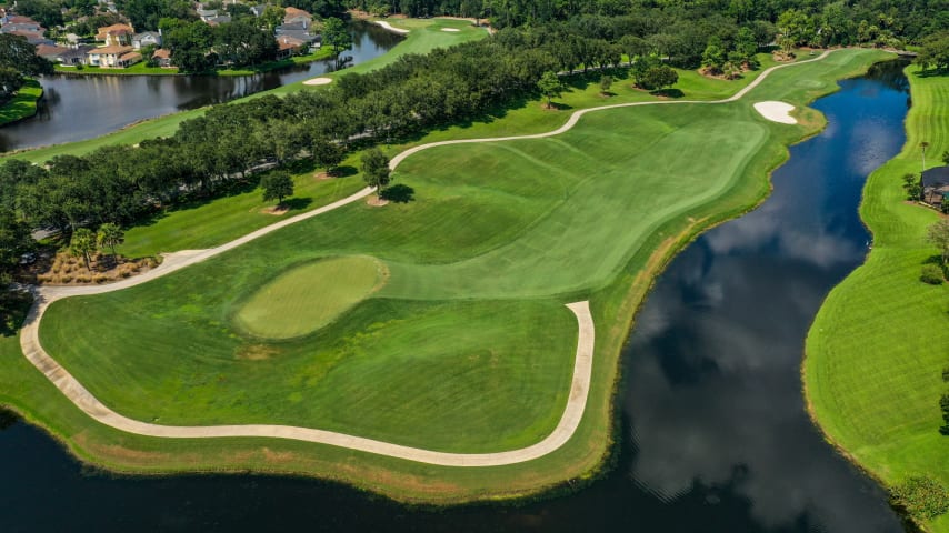 On this relatively short par 4, placement off the tee is the name of the game. Players can hit just about any club they wish off the tee but need to find the fairway or else risk water left and uneven hilly lies in the rough and a blind approach to the right. The elevated green, which drops off severely to the left and back, is inviting to wedges from the fairway. Just don’t leave yourself short on front pin locations as the ball may roll all the way back to where you are standing. This was the fifth-easiest hole in 2014.