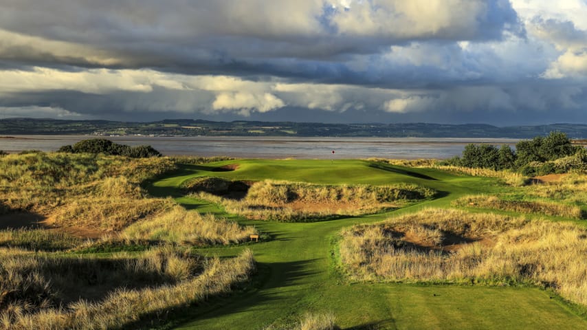 The new hole on the course is one everybody will be talking about come July. At just 140 or so yards, 'Little Eye', Hoylake's newest hole, is a simply stunning creation, with an infinity green on a par-3 that plays directly out towards the ocean and Wales, which is just a few miles away. The green is raised above the player significantly. The sea of bunkers and huge fall-off areas to all sides, including all the way to the green, provide a striking scene and mean it is absolutely essential to hit the green, as any miss will leave a devilishly difficult up and down. Once on the green, the undulations are considerable and making putts is not easy, nor is finding the right location with the tee shot. The views are stunning and the setting is dramatic. The leader of The Open in July will be very happy to walk off the 17th with a three, particularly if the wind is blowing. (Source: R&A)