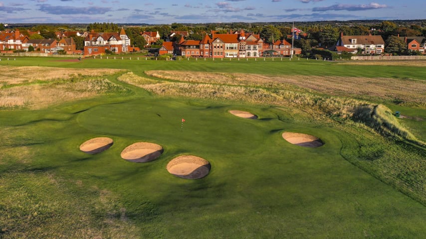 After navigating the 17th hole, the leader of The Open come Sunday 23 July will face a long walk toward the 18th tee, pondering the shot coming up the whole time, and it is no easy one. The 18th hole at Royal Liverpool, the members' 16th, has seen two incredible Champions since its introduction as the closing hole in The Open's routing. Tiger Woods claimed an emotional victory on the final green in 2006, while McIlroy secured his first and only Open to date in 2014 to a huge ovation around the surface. With significant changes in 2023, the hole will almost certainly produce even more drama this time round, and the potential Champion will have to produce a nerveless tee shot to help them on the way to victory. A remarkably intimidating opening stroke now awaits, as the Championship tee has been moved back around 50 yards and significantly further right, while the out of bounds down the right-hand side has ominously been moved 20 yards further left. The fairway now appears just a handful of yards wide from the tee, particularly with a necessary carry of 240 yards to reach the fairway and dangerous bunkers down the left. A brave tee shot is required, however, if players have any ambitions of a closing eagle, as with the additional length, the out of bounds is more in play for the second shot too as the hole curves to the right. On the approach, numerous bunkers surround the green, with the three on the left particularly likely to come into play for those bailing out to the left. This is a simply fantastic finishing hole that could produce double bogeys as easily as eagles. (Source: R&A)