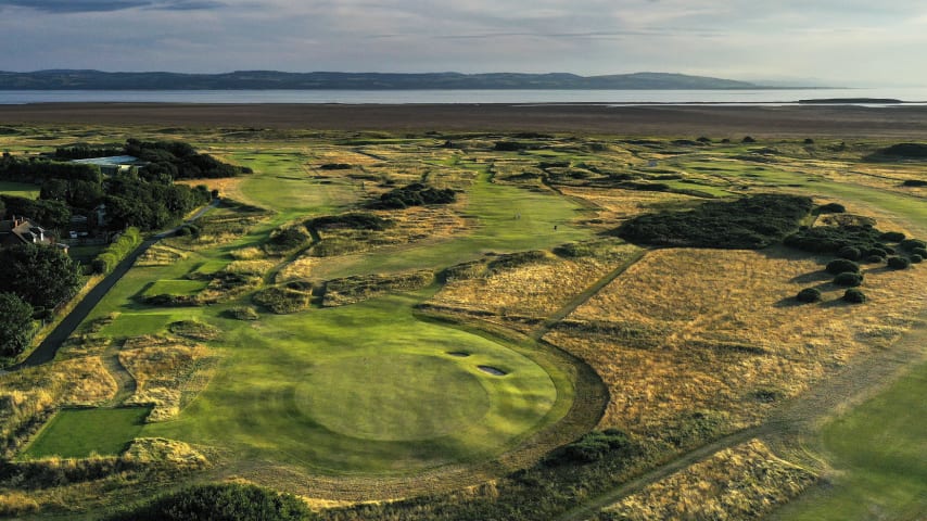 After a relatively calm three-hole stretch, the 7th at Hoylake reminds players how tough the course can be. An intimidating tee shot offers up significant challenges regardless of wind. Into a strong wind, the hole becomes brutally long, with a 250-yard drive required to even reach the fairway, whereas if the wind switches to an easterly and conditions are firm, carrying the ball onto the fairway and then stopping it short of the nasty bunkers on both sides of the driving area will be tricky. Gorse awaits very loose shots to the left and right from the tee. If the fairway is found, the approach is a bit more straightforward, with lots of room to the right to work a ball towards the surface, although shots taking on the left-hand side of the green risk bringing two gaping bunkers into play. The surface itself is at the same height as most of the surrounding area, however it moves a lot and reading it correctly is not easy. Par on this hole will undoubtedly gain on the field come July. (Source: R&A)