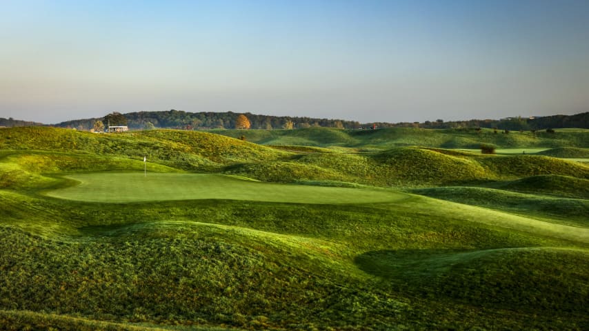 A dogleg-right with a huge bunker on the bottom right of the fairway, the tee shot on the 12th is no easy matter. In fact, the longer your drive is, the narrower the fairway gets. Only a drive carrying the bunker and ending up in the bottleneck a few yards ahead will offer you the ideal spot for your second shot to this elevated green. Players heading for the green from either the high rough or the bunker seldom reach the putting surface with their second shot and they might even struggle scrambling on this large, bumpy green. (Source: PGA of America)