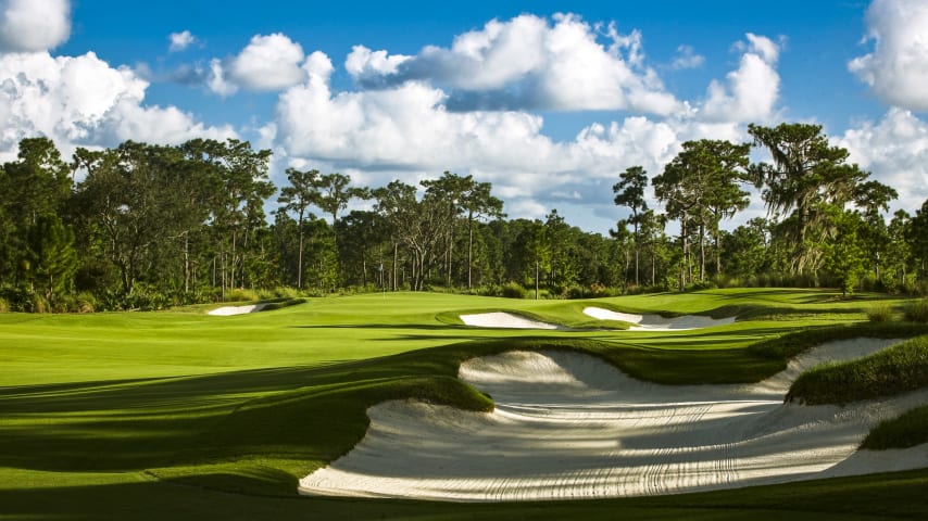 A well placed drive to the left-center of this dogleg left par 4 opens up the green for a mid-iron approach. Shots to the front half of the green are best. Avoid the two bunkers that guard the putting surface.