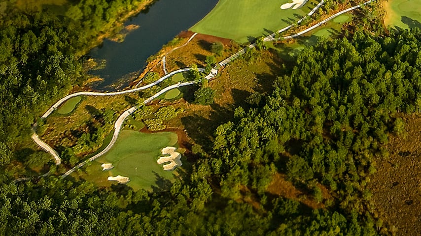 Hole location will determine how this long par 3 should be played. If the pin is back left, add one club and be aggressive. If the pin is middle to right front, being short is okay. Large bunkers frame the elevated green.