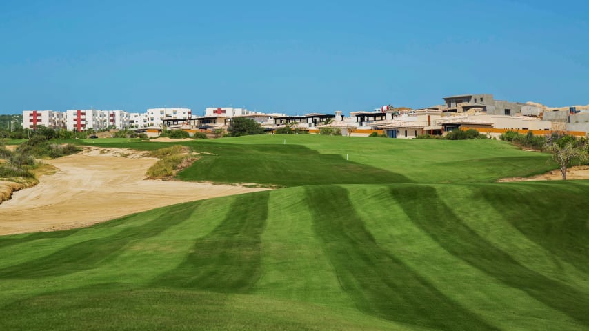 Designed around a narrow, sandy tributary of a larger arroyo, this hole challenges golfers with a "cape" tee shot. Aggressive players can carry the arroyo on the left for a shorter second shot. Playing to the right leaves a longer approach. The second landing area features a central sand ribbon, dividing it into left and right sections. Opting for the left side sets up a more straightforward approach to the green, while the right section requires negotiating a desert plum guarding the green's right side.