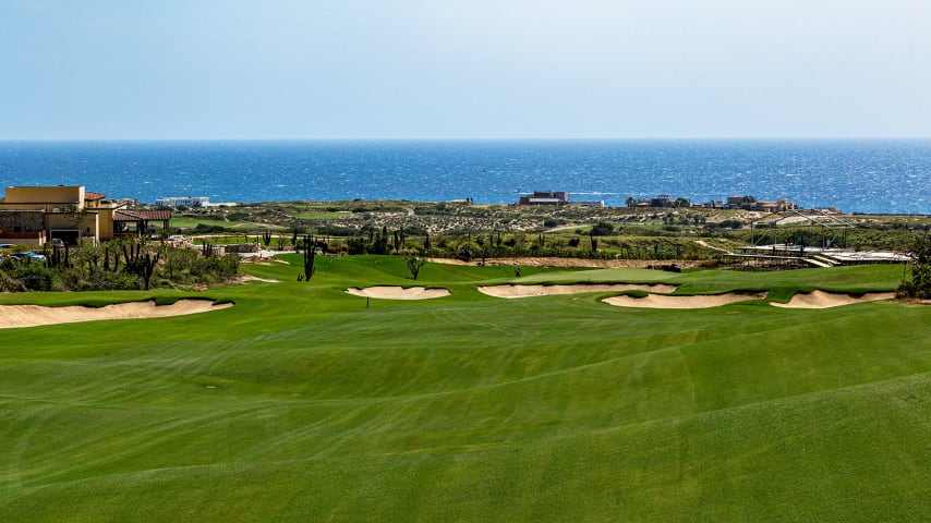 The final hole invites an aggressive tee shot, playing downhill more than 60 feet from tee to green. Longer hitters can aim to carry cross bunkers near the second landing area, setting up a chance to advance closer to the green. A successful carry will result in a favorable kick forward. The lengthy, narrow green is surrounded by deep low areas and a bunker left. The prevailing right-to-left wind adds complexity to high wedge approach shots. 