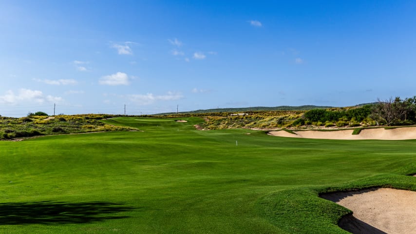 Playing in the opposite direction of the third hole, this lengthy par 4 challenges golfers into a prevailing wind. A tee shot favoring the right side of the fairway provides the shortest approach to an elevated green guarded by a bunker on the right. The subtly contoured green offers opportunities for up-and-down recoveries for those who miss their targets.