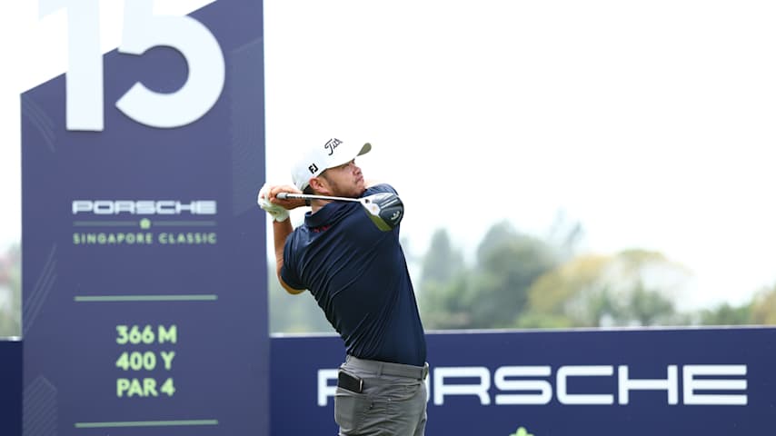Zihao Jin of China tees off on the 15th hole on day two of the Porsche Singapore Classic 2025 at Laguna National Golf Resort Club on March 21, 2025 in Singapore, Singapore. (Pakawich Damrongkiattisak/Getty Images)
