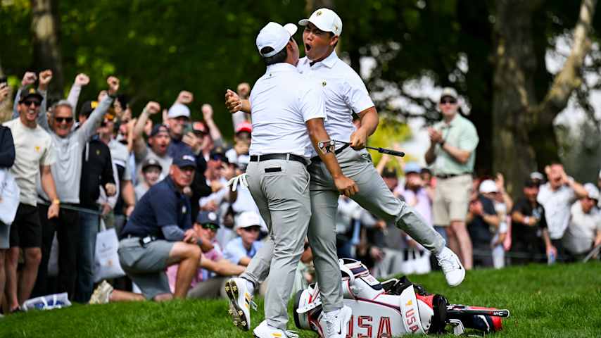 MONTREAL, QUEBEC - SEPTEMBER 28: Tom Kim of the International Team celebrates with teammate Si Woo Kim after a birdie on the 14th hole during Four-Ball matches on day three of the 2024 Presidents Cup at The Royal Montreal Golf Club on September 28, 2024 in Montreal, Quebec. (Photo by Keyur Khamar/PGA TOUR via Getty Images)