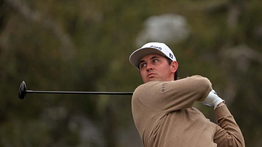 J.T. Poston of the United States plays his shot from the 15th tee during the third round of the AT&T Pebble Beach Pro-Am 2026 at Pebble Beach Golf Links on February 14, 2026 in Pebble Beach, California. (Mike Mulholland/Getty Images)