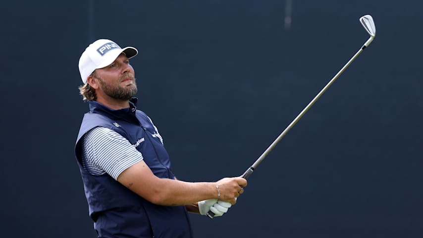 Dan Brown of England plays his shot from the 14th tee during the first round of the PGA Championship at Aronimink Golf Club on May 14, 2026 in Newtown, Pennsylvania. (Richard Heathcote/Getty Images)