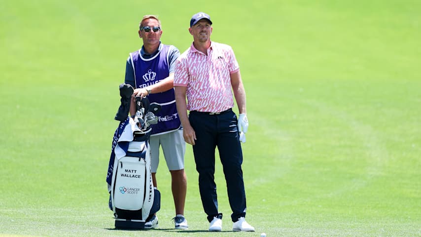 Matt Wallace of England and his caddie look over a shot on the 14th hole during the second round of the Truist Championship 2026 at Quail Hollow Country Club on May 08, 2026 in Charlotte, North Carolina. (Andrew Redington/Getty Images)