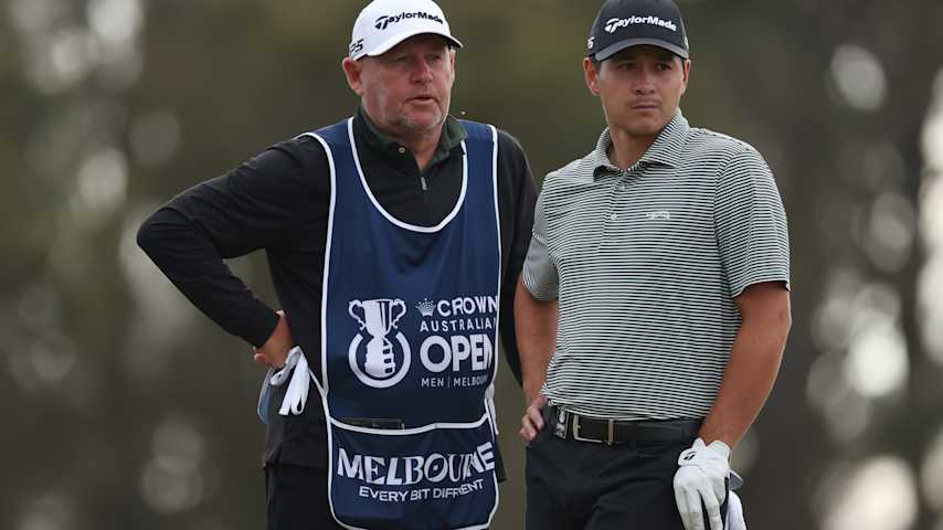 Karl Vilips of Australia alongside his caddie prepares to play his second shot on the 14th hole on day two of the Crown Australian Open 2025 at The Royal Melbourne Golf Club on December 05, 2025 in Melbourne, Australia. (Morgan Hancock/Getty Images)