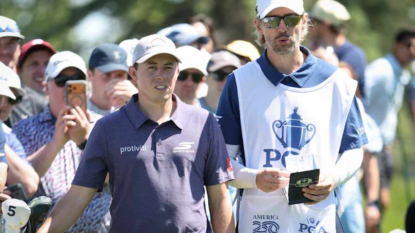 Matt Fitzpatrick of England and his caddie Daniel Parratt look over an upcoming shot on the fourth hole during the third round of the PGA Championship at Aronimink Golf Club on May 16, 2026 in Newtown, Pennsylvania. (Jamie Squire/Getty Images)