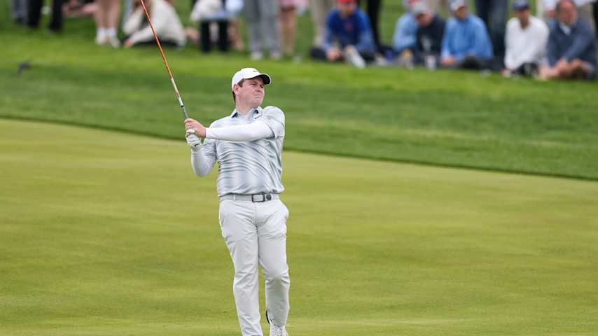 Robert MacIntyre of Scotland plays a shot on the ninth hole during the first round of the PGA Championship at Aronimink Golf Club on May 14, 2026 in Newtown, Pennsylvania. (Richard Heathcote/Getty Images)