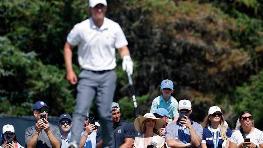 Fans watch as Maverick McNealy of the United States prepares to play a shot from the sixth tee during the third round of the 126th U.S. OPEN at Shinnecock Hills Golf Club on June 20, 2026 in Southampton, New York. (Cliff Hawkins/Getty Images)