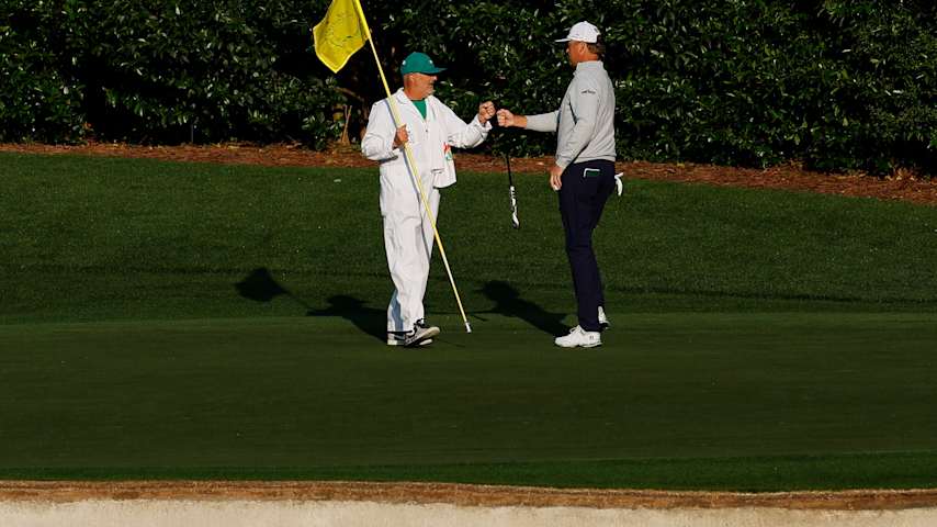 Patton Kizzire of the United States celebrates a birdie putt on the fourth green with his caddie Dean Emerson during the first round of the 2025 Masters Tournament at Augusta National Golf Club on April 10, 2025 in Augusta, Georgia. (Harry How/Getty Images)