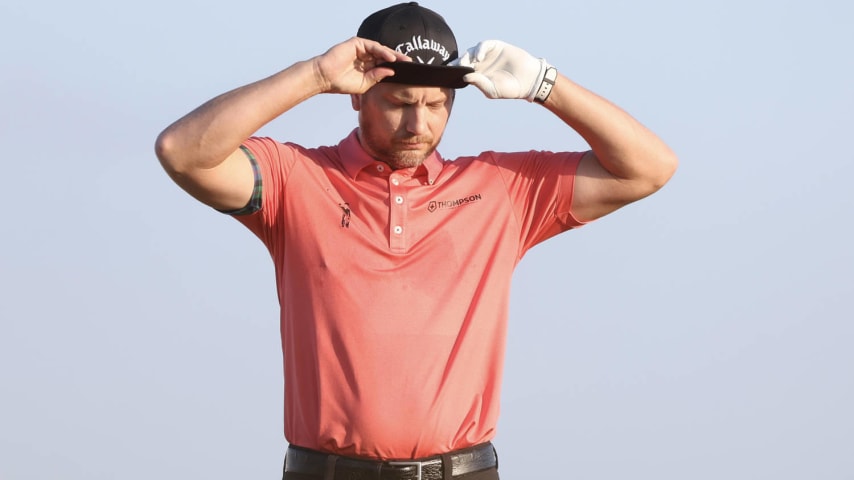 SOUTHAMPTON, BERMUDA - NOVEMBER 09: Chris Stroud of the United States adjusts his hat on the tenth tee during the first round of the Butterfield Bermuda Championship at Port Royal Golf Course on November 09, 2023 in Southampton, Bermuda. (Photo by Marianna Massey/Getty Images)