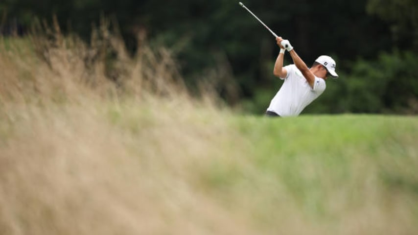 GREENSBORO, NORTH CAROLINA - AUGUST 06: Michael Kim of the United States plays his shot from the 12th tee during the final round of the Wyndham Championship at Sedgefield Country Club on August 06, 2023 in Greensboro, North Carolina. (Photo by Jared C. Tilton/Getty Images)