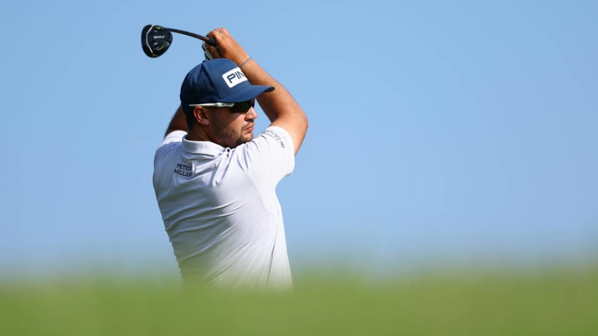 SINGAPORE, SINGAPORE - MARCH 22: Thriston Lawrence of South Africa tees off on the 15th hole during Day Two of the Porsche Singapore Classic at Laguna National Golf Resort Club on March 22, 2024 in Singapore. (Photo by Yong Teck Lim/Getty Images)