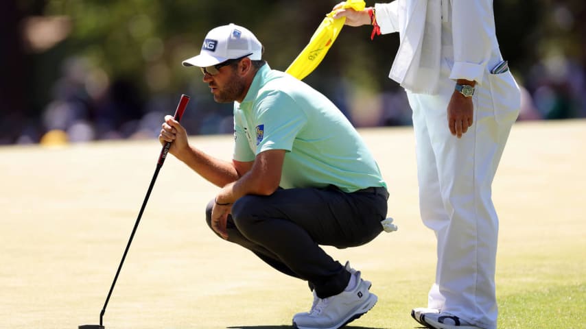 AUGUSTA, GEORGIA - APRIL 13: Corey Conners of Canada lines up a putt on the third green during the third round of the 2024 Masters Tournament at Augusta National Golf Club on April 13, 2024 in Augusta, Georgia. (Photo by Jamie Squire/Getty Images) (Photo by Jamie Squire/Getty Images)