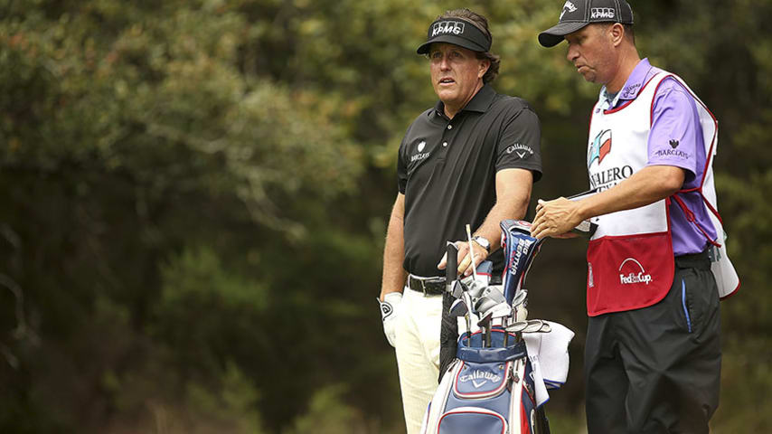SAN ANTONIO, TX - MARCH 27:  Phil  Phil Mickelson and his caddy Jim Mackay wait to tee off on the 14th during Round One of the Valero Texas Open at the AT&T Oaks Course on March 27, 2014 in San Antonio, Texas.  (Photo by Darren Carroll/Getty Images)
