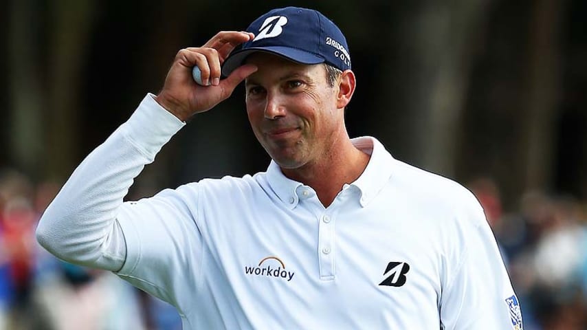 HILTON HEAD ISLAND, SC - APRIL 20: Matt Kuchar acknowledges the gallery on the 18th green during the final round of the RBC Heritage at Harbour Town Golf Links on April 20, 2014 in Hilton Head Island, South Carolina.  (Photo by Streeter Lecka/Getty Images)