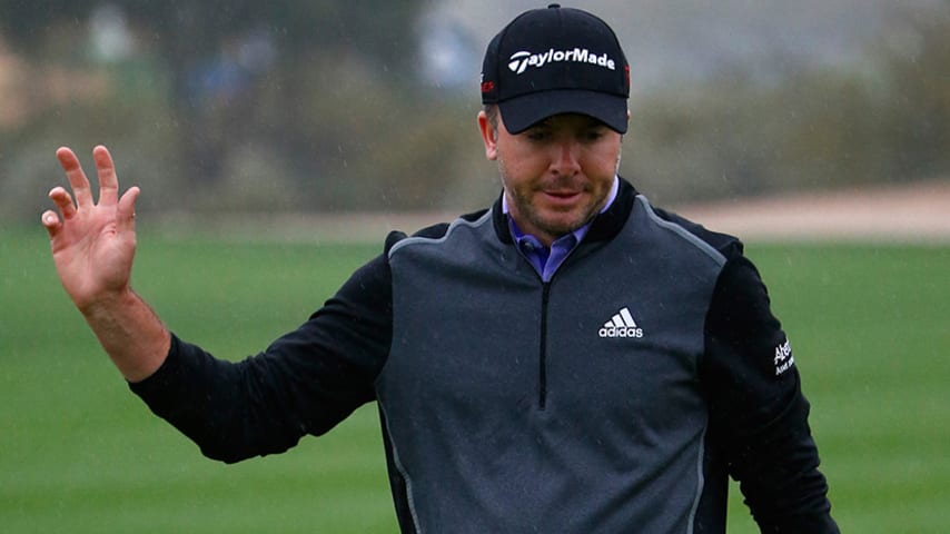 SCOTTSDALE, AZ - JANUARY 30: Martin Laird of Scotland acknowledges the crowd on the 9th green during the second round of the Waste Management Phoenix Open at TPC Scottsdale on January 30, 2015 in Scottsdale, Arizona.  (Photo by Sam Greenwood/Getty Images)