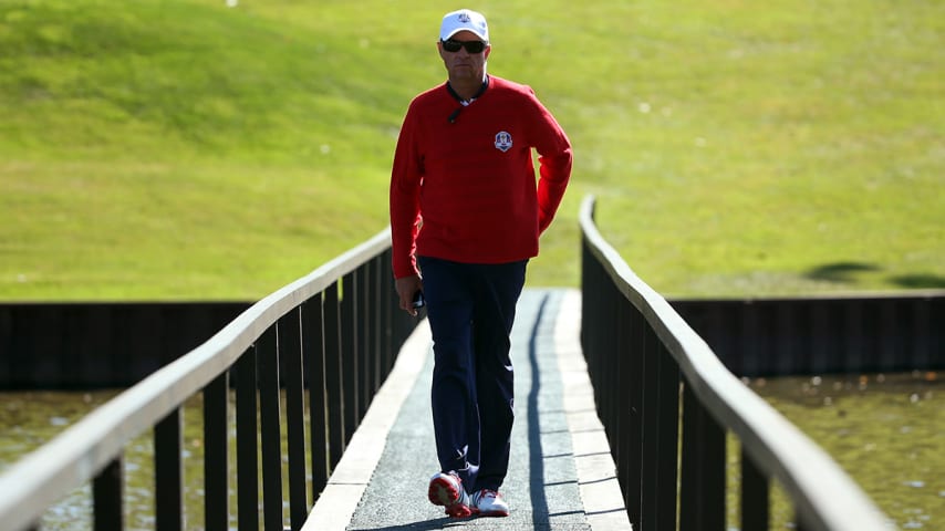 MEDINAH, IL - SEPTEMBER 30:  USA team captain Davis Love III of the United States crosses a bridge during the Singles Matches for The 39th Ryder Cup at Medinah Country Club on September 30, 2012 in Medinah, Illinois.  (Photo by Andrew Redington/Getty Images)