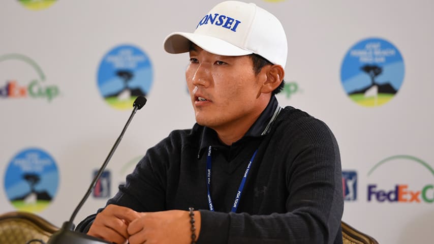 PEBBLE BEACH, CA - FEBRUARY 12:  Sung Kang of Korea interacts with media during a press conference following his second round of the AT&T Pebble Beach National Pro-Am at the Monterey Peninsula Country Club on February 12, 2016 in Pebble Beach, California.  (Photo by Josh Hedges/Getty Images)