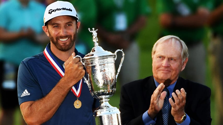 OAKMONT, PA - JUNE 19:  Dustin Johnson of the United States celebrates with the winner's trophy alongside Jack Nicklaus after winning the U.S. Open at Oakmont Country Club on June 19, 2016 in Oakmont, Pennsylvania.  (Photo by Ross Kinnaird/Getty Images)