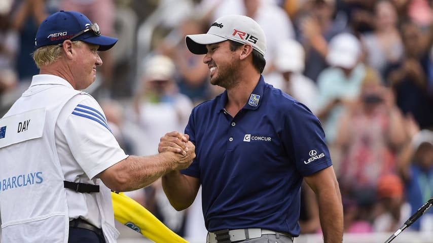 EDISON, NJ - AUGUST 30:  Jason Day of Australia greets his caddie Colin Swatton after his six-stroke victory on the 18th hole green during the final round of The Barclays at Plainfield Country Club on August 30, 2015 in Edison, New Jersey. (Photo by Chris Condon/PGA TOUR)