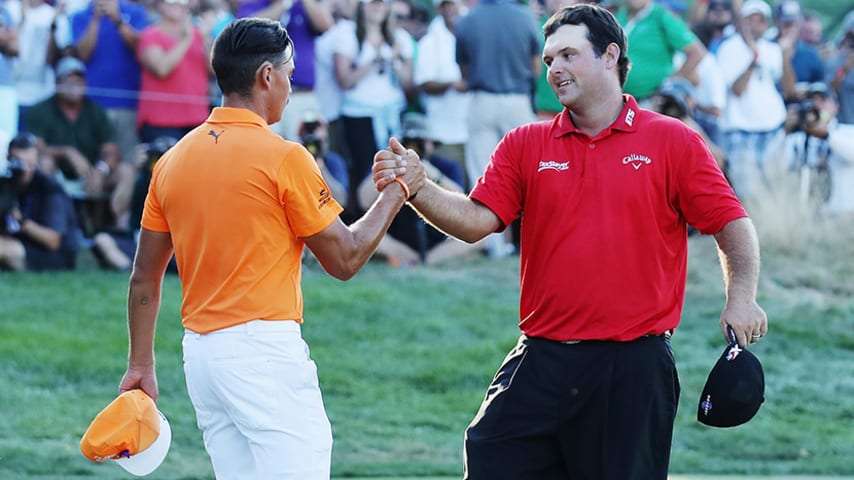 FARMINGDALE, NY - AUGUST 28:  Patrick Reed (R) greets Rickie Fowler on the 18th green after Reed won The Barclays in the PGA Tour FedExCup Play-Offs on the Black Course at Bethpage State Park on August 28, 2016 in Farmingdale, New York.  (Photo by David Cannon/Getty Images)