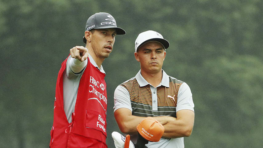 SHANGHAI, CHINA - OCTOBER 27:  Rickie Fowler of the United States waits with his caddie Joe Skovron on the ninth hole during the first round of the WGC - HSBC Champions at the Sheshan International Golf Club on October 27, 2016 in Shanghai, China.  (Photo by Scott Halleran/Getty Images)