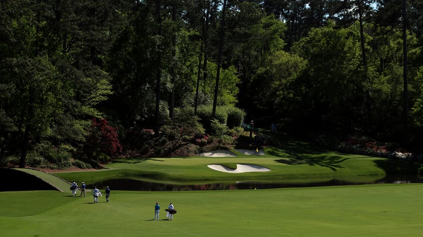 AUGUSTA, GEORGIA - APRIL 07:  Rafa Cabrera Bello of Spain, Davis Love III of the United States and Charl Schwartzel of South Africa walk across the Hogan bridge to the 12th green during the first round of the 2016 Masters Tournament at Augusta National Golf Club on April 7, 2016 in Augusta, Georgia.  (Photo by Andrew Redington/Getty Images)