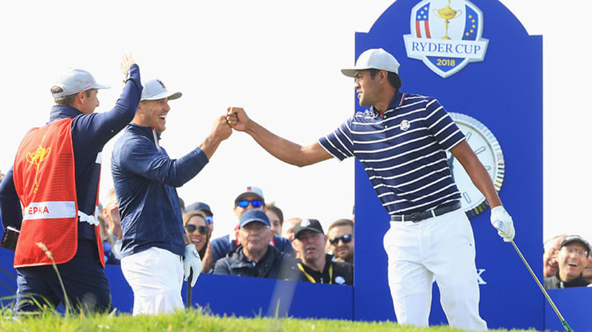 PARIS, FRANCE - SEPTEMBER 28: Tony Finau of the United States and Brooks Koepka of the United States celebrate during the morning fourball matches of the 2018 Ryder Cup at Le Golf National on September 28, 2018 in Paris, France. (Photo by Andrew Redington/Getty Images)