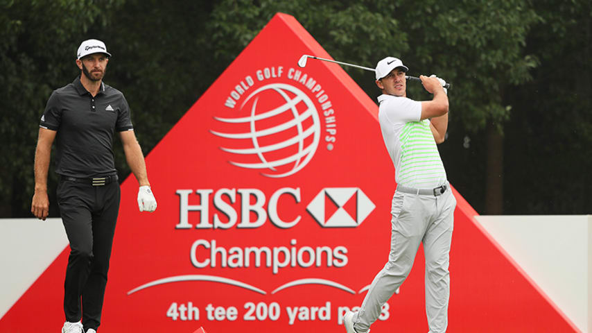 SHANGHAI, CHINA - OCTOBER 29: Brooks Koepka of the United States plays his shot from the fourth tee as Dustin Johnson of the United States looks on during the final round of the WGC - HSBC Champions at Sheshan International Golf Club on October 29, 2017 in Shanghai, China. (Photo by Andrew Redington/Getty Images)