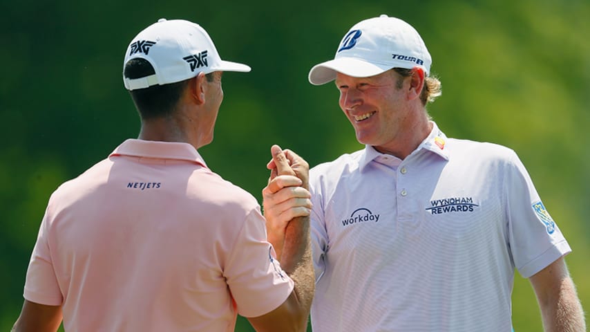 GREENSBORO, NC - AUGUST 16:  Brandt Snedeker(R) is congratulated by Billy Horschel following a birdie putt on the ninth green during the first round of the Wyndham Championship at Sedgefield Country Club on August 16, 2018 in Greensboro, North Carolina.  (Photo by Kevin C. Cox/Getty Images)