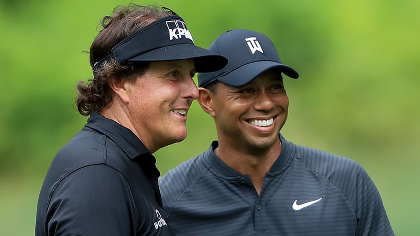 AKRON, OH - AUGUST 01:  Phil Mickelson (L) and Tiger Woods smile during a practice round prior to the World Golf Championships-Bridgestone Invitational at Firestone Country Club South Course on August 1, 2018 in Akron, Ohio.  (Photo by Sam Greenwood/Getty Images)