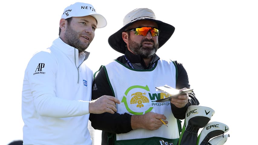 SCOTTSDALE, ARIZONA - FEBRUARY 01: Branden Grace of South Africa speaks with his caddie on the 11th tee during the second round of the Waste Management Phoenix Open at TPC Scottsdale on February 01, 2019 in Scottsdale, Arizona. (Photo by Christian Petersen/Getty Images)